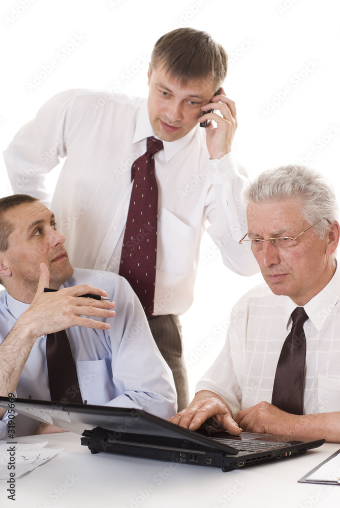 Three businessmen working Three businessmen working