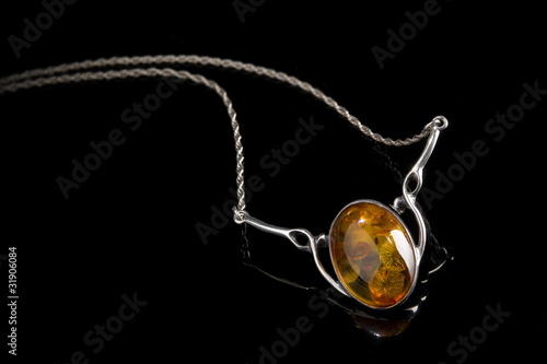 amber pendant on silver necklace