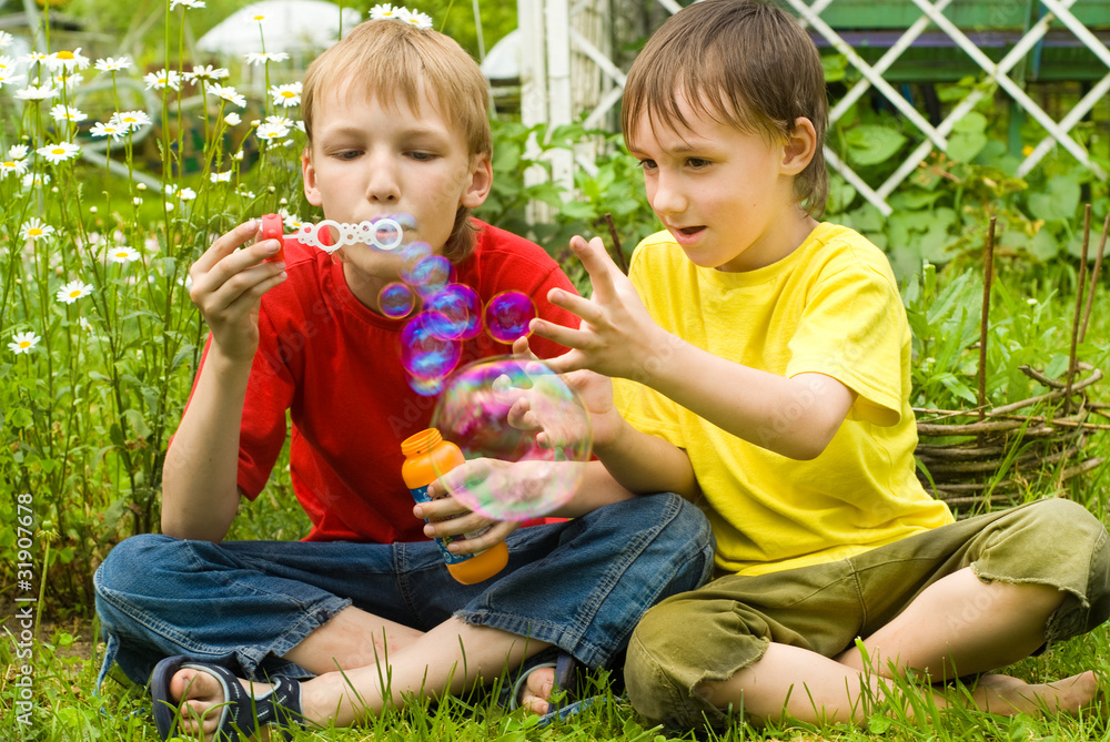 Two brothers blow bubbles Two brothers blow bubbles