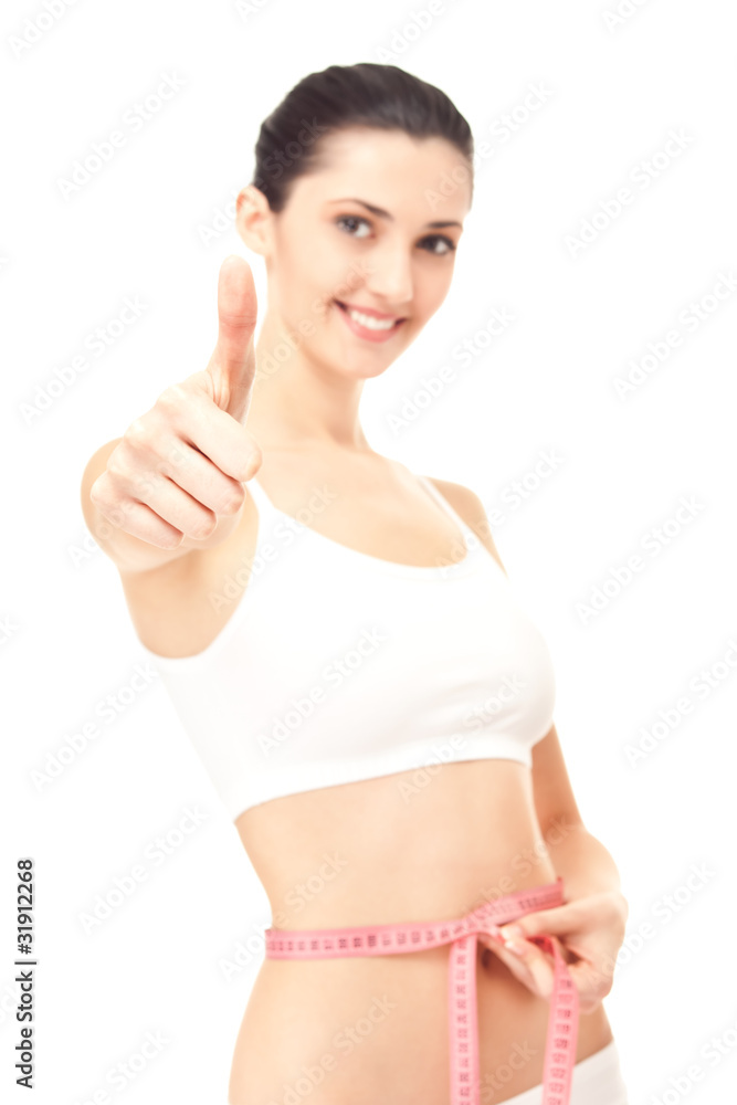 healthy woman success measuring her waistline healthy woman success measuring her waistline