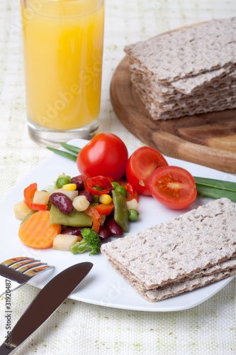 Rye Crispbread and frehs vegetable photo