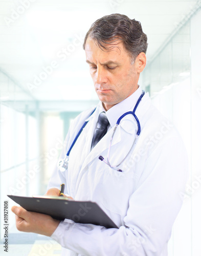 medical doctor with stethoscope. Isolated over white