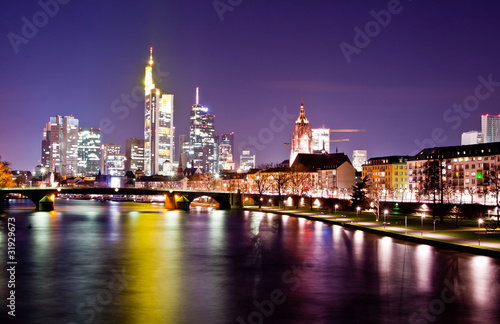 Night view on the Frankfurt skyline with reflections on water