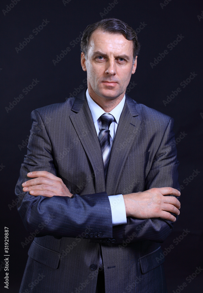 Portrait of a successful young business man with his Portrait of a successful young business man with his