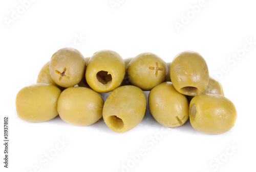 Some green pitted olives isolated on the white background
