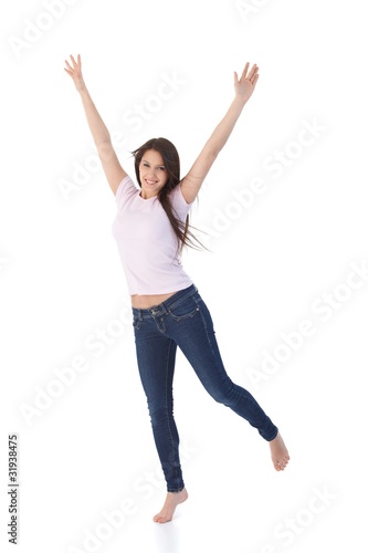 Young woman jumping up happily