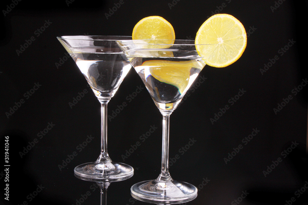 Martini glasses on black background
