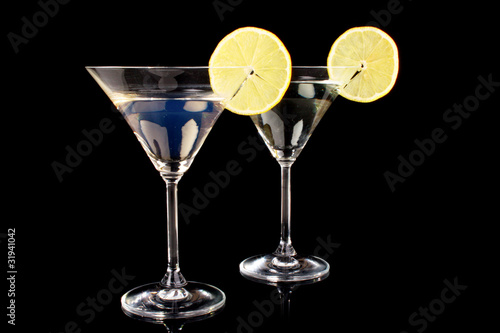 Martini glasses on black background