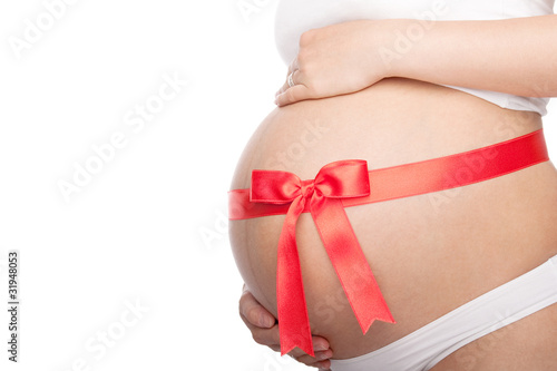 Wallpaper Mural Beautiful young pregnant woman with ribbon. Isolated Torontodigital.ca