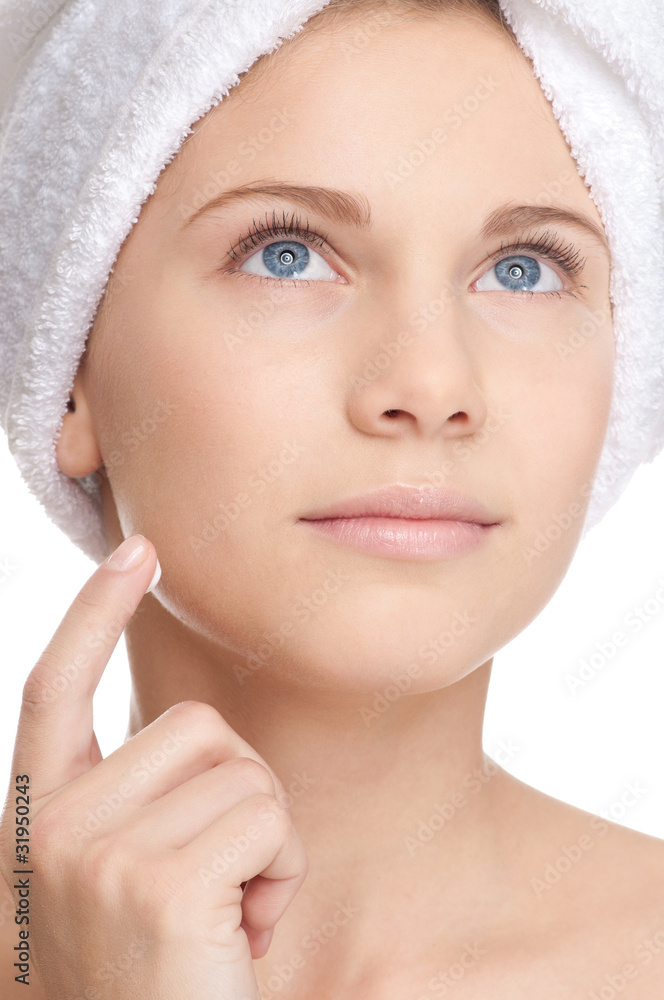 Young beautiful girl applying cream Young beautiful girl applying cream