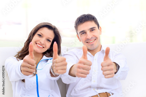 portrait of a lovely young couple sitting on the couch