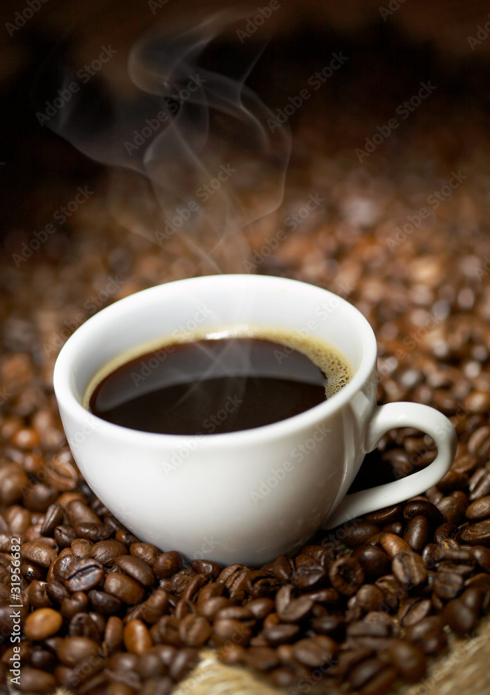 Coffee cup with roasted beans Coffee cup with roasted beans