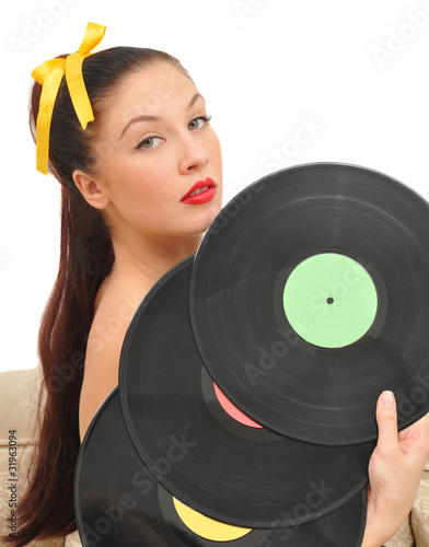 nice girl with vinyl disks look at camera photo