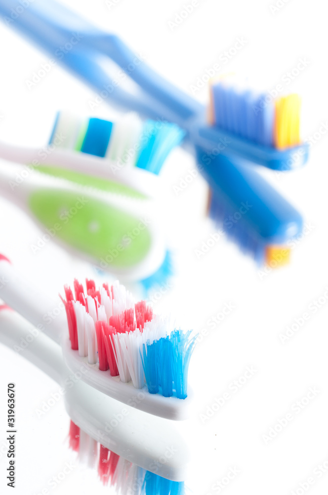 Closeup colorful toothbrush on a white background Closeup colorful toothbrush on a white background