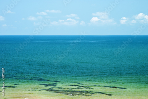 Sand beach  sea and blue sky