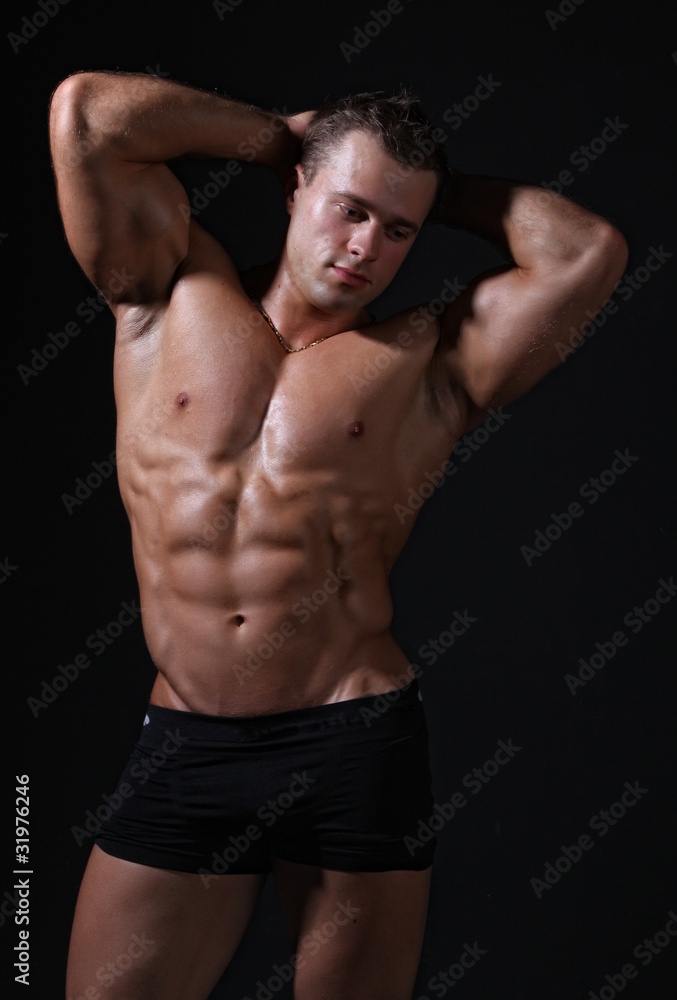Muscle sexy wet nude young man posing in trunks Muscle sexy wet nude young man posing in trunks