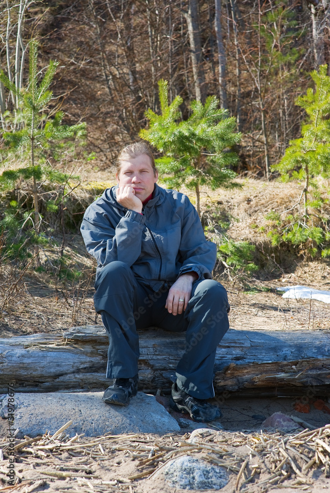 Man sitting on a log