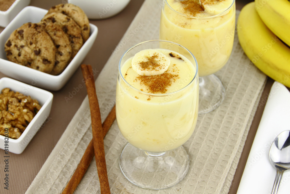 Glass with sweet banana pudding dessert Glass with sweet banana pudding dessert