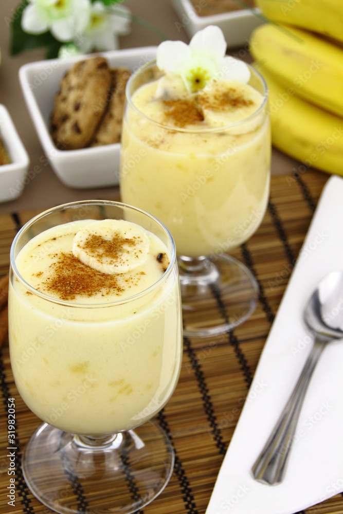 Glass with sweet banana pudding dessert Glass with sweet banana pudding dessert