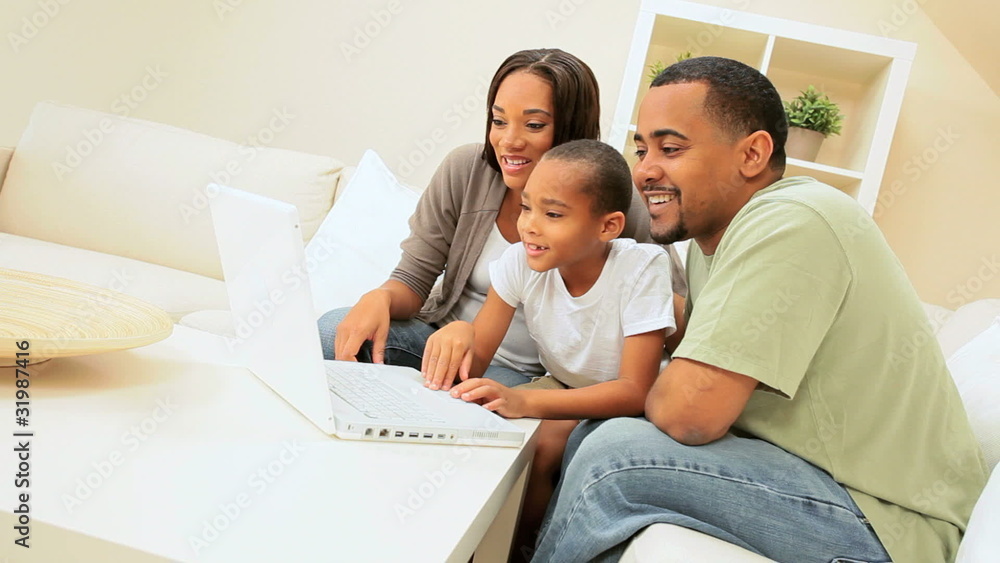 African American Family Sharing a Laptop African American Family Sharing a Laptop
