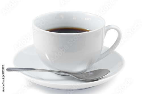 Cup of coffee with spoon and saucer