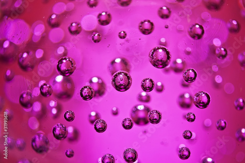 Many little pink air bubble in the glass sphere