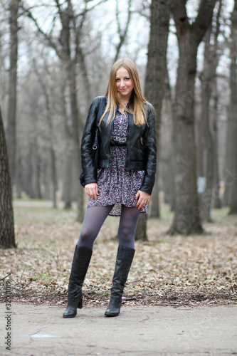 Full length, walking woman in autumn park © Andrey_Arkusha