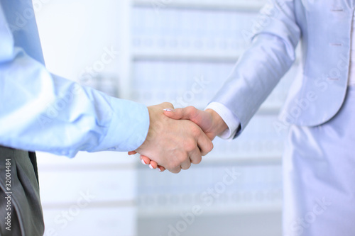 Business men hand shake in the office