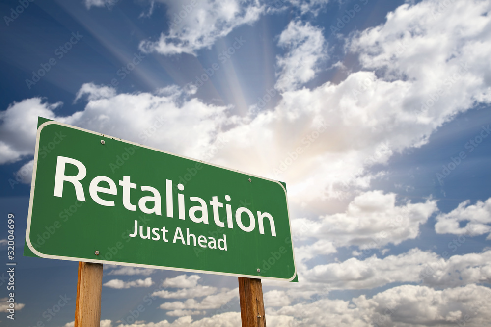 Fotografie Retaliation Green Road Sign Against Dramatic Sky