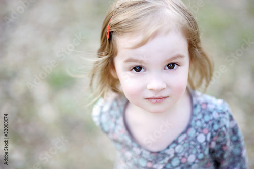 Adorable happy toddler girl smiling outdoors