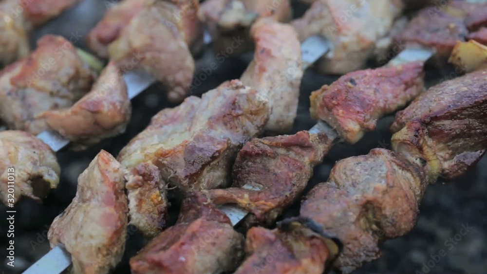 Shashlik - shish kebab - Russian BBQ grilled meat on the coals Shashlik - shish kebab - Russian BBQ grilled meat on the coals