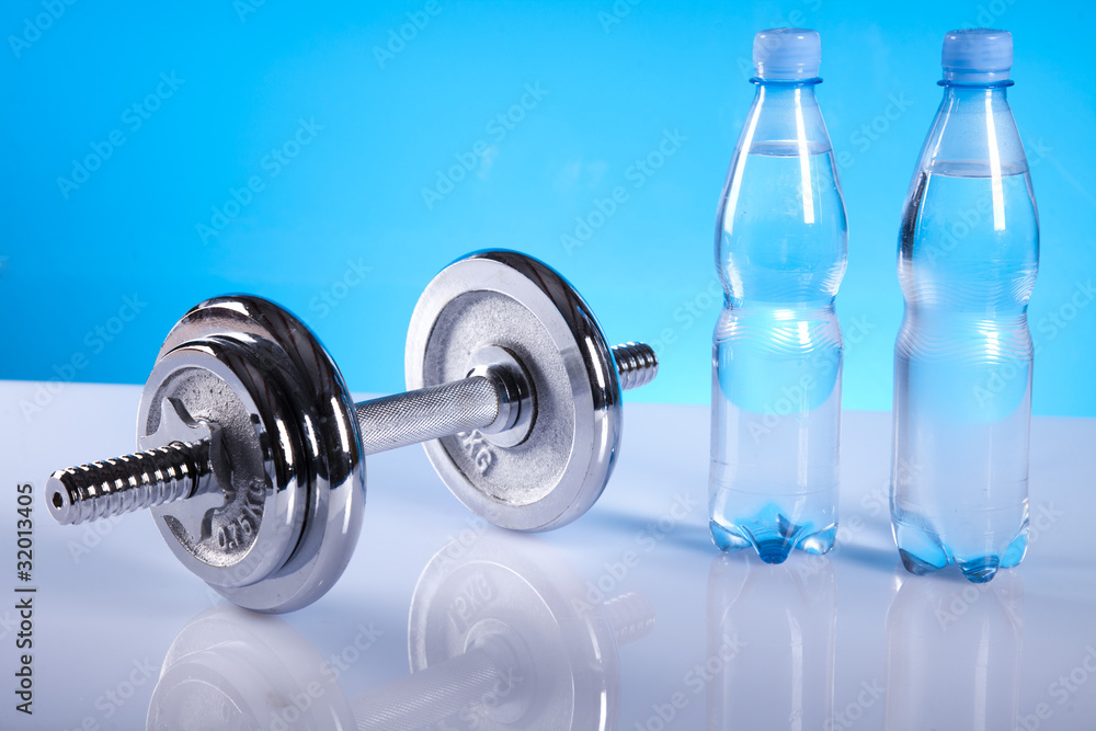 Obraz premium dumbell and bottles of water