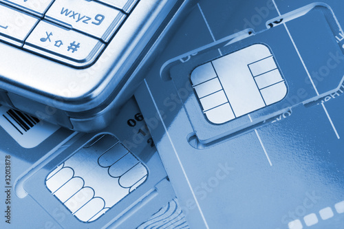Принти на полотні Mobile phone with sim cards
