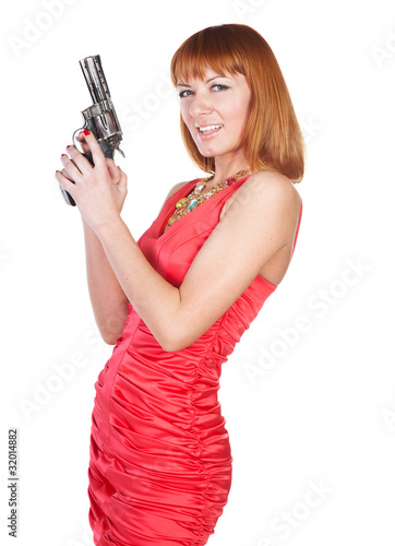 Beautiful woman in a red dress with a gun