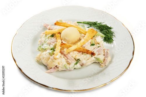 Potato salad, ham, cucumber and eggs on plate