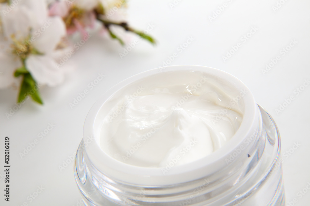 Face cream and almond flowers Face cream and almond flowers