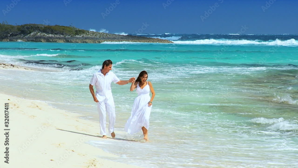 Happy Couple Enjoying Luxury Beach Vacation Happy Couple Enjoying Luxury Beach Vacation