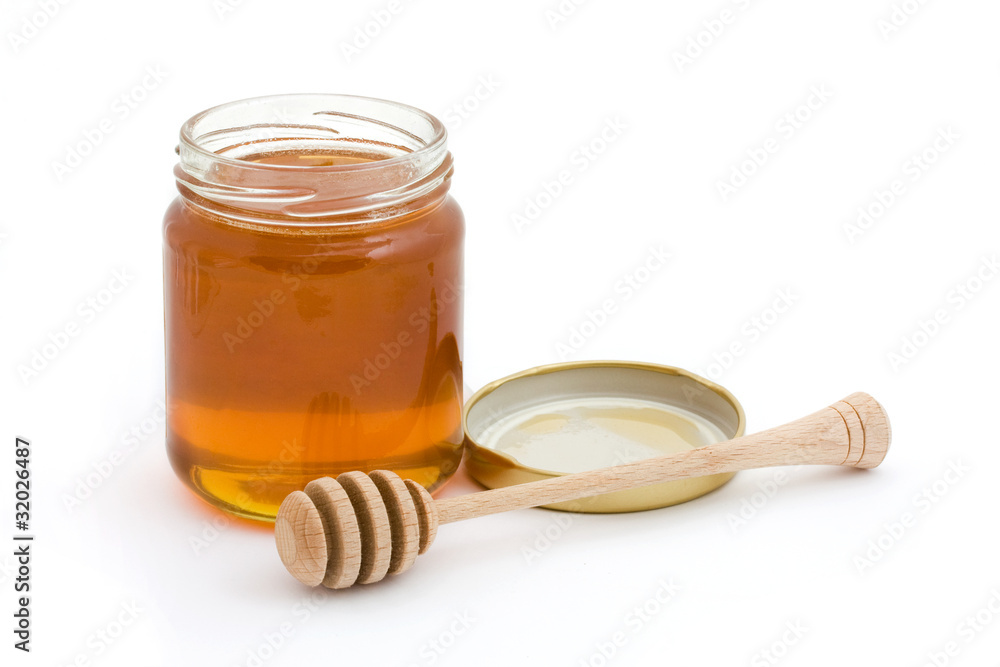 Jar of open honey with drizzler Jar of open honey with drizzler