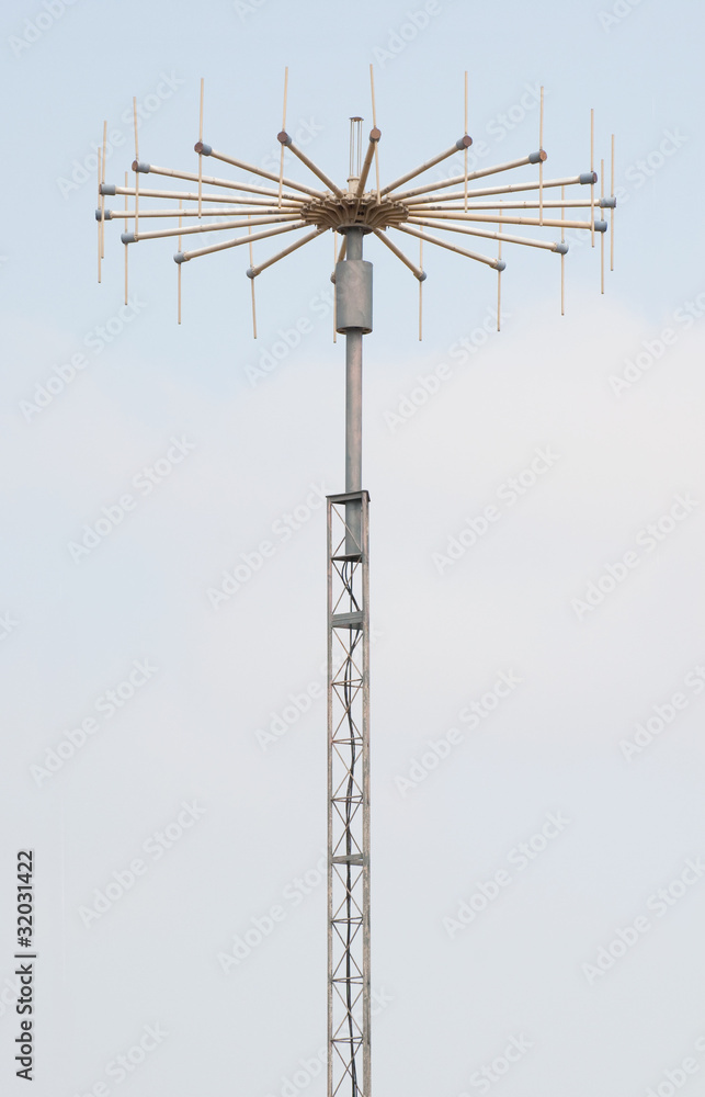 antenna on mast on blue sky background antenna on mast on blue sky background