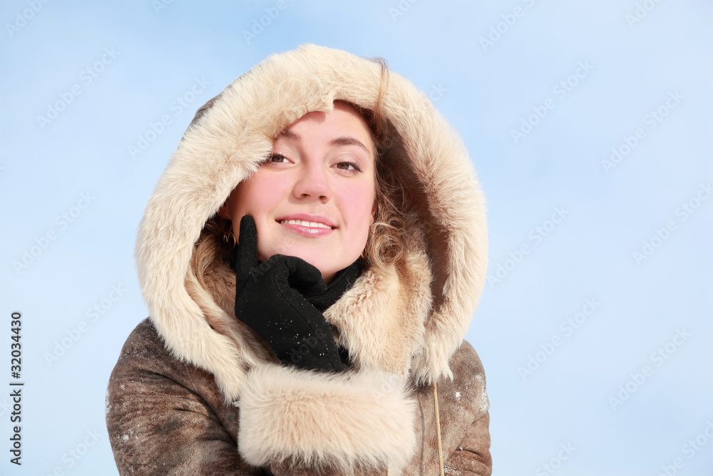 Portrait of girl which leans chin on hand in winter Portrait of girl which leans chin on hand in winter