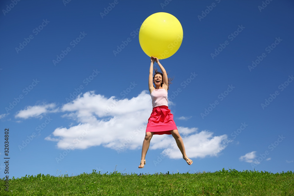 Woman by canicular day descend on inflatable ball Woman by canicular day descend on inflatable ball