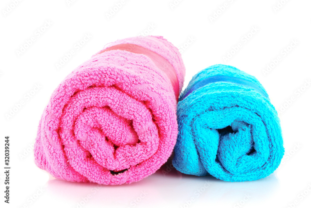 Twisted blue and pink towels with bands isolated on white Twisted blue and pink towels with bands isolated on white