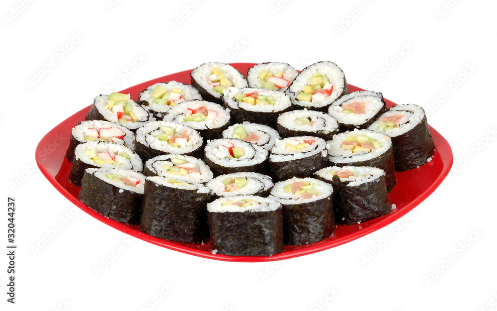 Japanese cuisine - sushi roll on red plate on white backround Japanese cuisine - sushi roll on red plate on white backround