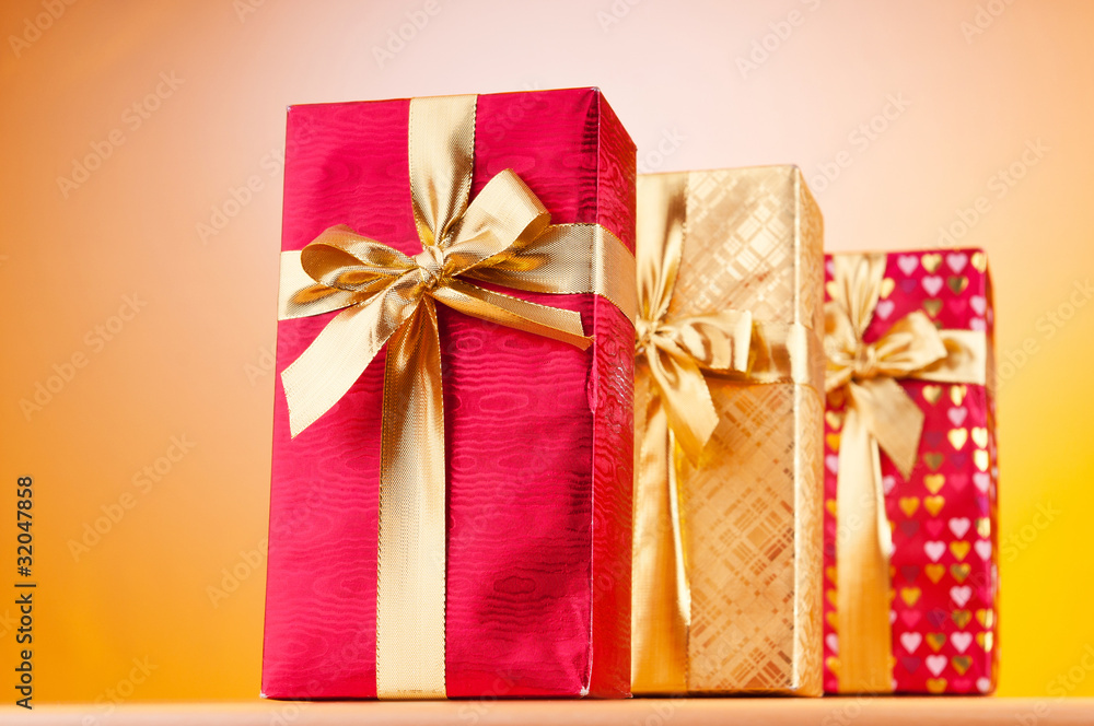 Celebration concept - Gift box against colorful background Celebration concept - Gift box against colorful background