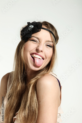 Fotografi blonde girl on white background, grimace