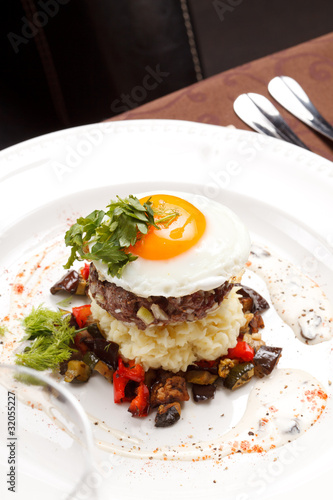 beef burger with egg and potatoes