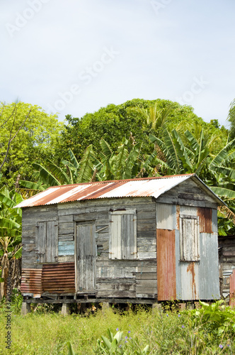 ramshackle zinc clapboard house jungle Corn Island Nicaragua © robert lerich