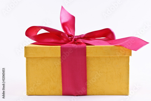 yelloy present box with ribbon bow photo