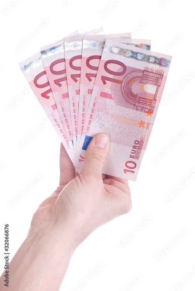 Ten Euro banknotes in female hand Ten Euro banknotes in female hand