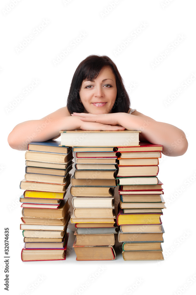 Young smiling woman with heap of books isolated Young smiling woman with heap of books isolated